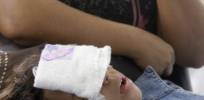 A child with dengue symptoms waits for medical attention at a hospital in the neighborhood of Realengo, in Rio de Janeiro, Tuesday, March 25, 2008. The Brazilian Health Minister announced Monday it is sending hundreds of health workers to Rio de Janeiro state to help overwhelmed emergency rooms that are reporting 80 new cases of dengue fever per hour.(AP Photo/ Ricardo Moraes),A child with dengue symptoms waits for medical attention at a hospital in the neighborhood of Realengo, in Rio de Janeiro, Tuesday, March 25, 2008. The Brazilian Health Minister announced Monday it is sending hundreds of health workers to Rio de Janeiro state to help overwhelmed emergency rooms that are reporting 80 new cases of dengue fever per hour.(AP Photo/ Ricardo Moraes)