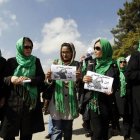 Women’s rights activists march to support Afghan lawmaker Semin Barekzai during a demonstration in Kabul