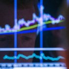 A trader watches his screen just after the opening bell on the floor of the New York Stock Exchange
