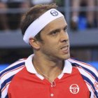 Gilles Muller of Luxembourg reacts after winning a point against John Isner of the U.S. during their men’s singles third round match at the Australian Open 2015 tennis tournament in Melbourne