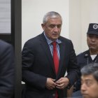Guatemala's former president Otto Perez Molina enters the court room to face corruption charges, in Guatemala City, Thursday, Sept. 3, 2015. Perez Molina resigned late Wednesday after a judge issued an order for this detention, accused of leading a customs fraud ring. (AP Photo/Luis Soto)
