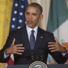 President Barack Obama answers questions during a joint news conference with Mexican President Enrique Pena Nieto in the East Room of the White House in Washington, Friday, July 22, 2016. Obama fiercely rejected Donald Trump's depiction of an America in crisis on Friday, arguing that violent crime and illegal immigration have plunged under his leadership to their lowest rates in decades.  (AP Photo/Pablo Martinez Monsivais)