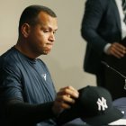 New York Yankees designated hitter Alex Rodriguez picks up his cap after announcing that Friday, Aug. 12, 2016, will be his last game as a player during a news conference at Yankee Stadium in New York, Sunday, Aug. 7, 2016. Rodriguez will continue on in a role as a special advisor to the team and an instructor through Dec. 31, 2017. (AP Photo/Kathy Willens)