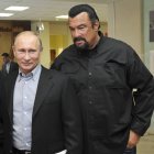 FILE - In this file photo taken on Wednesday, March 13, 2013, Russian President Vladimir Putin, left, and U.S. movie actor Steven Seagal visit a new sports arena in Moscow, Russia. file photo, Russian President Vladimir Putin, right, speaks with U.S. actor Steven Seagal in the Russian Far Eastern port of Vladivostok. Russian President Vladimir Putin has awarded Russian citizenship to action film actor Steven Seagal, the Kremlin said Thursday. Nov. 3, 2016. ﻿The 64-year-old Seagal has been a regular visitor to Russia in recent years and has accompanied Putin to several martial arts events, as well as vocally defending the Russian leader's policies and criticizing the U.S. government. (Alexei Nikolsky/Sputnik, Kremlin File Pool Photo via AP, File)