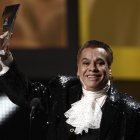 FILE - In this Nov. 5, 2009, file photo, Mexican singer Juan Gabriel accepts the person of the year award at the 10th Annual Latin Grammy Awards in Las Vegas. Representatives of Juan Gabriel have reported Sunday, Aug. 28, 2016, that he has died. Gabriel was Mexico's leading singer-songwriter and top-selling artist with sales of more than 100 million albums. The statement says he died Sunday, but did not say where. (AP Photo/Matt Sayles, File)