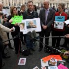 Peter Isely (R), John Pilmaier (C) and Barbara Blaine (R), all of the US organisation SNAP (Survivors Network of those Abused by Priests), hold up a picture of Pope benedict XVI on March 26, 2010 as they take part in a demonstration against child sexual abuse, in front of St. Peter's Square at the Vatican. The Vatican is engaging in a vigorous defence of Pope Benedict XVI after a new set of revelations emerged alleging he failed to act to stop a child-molesting US priest. The Roman Catholic Church's morals watchdog was headed by Benedict, then a cardinal, when it was warned about Reverend Lawrence Murphy, who was accused of abusing up to 200 deaf children between 1950 and 1974. The case follows a long series of sex abuse scandals involving priests, and for the Catholic faithful, it is having an destructive impact on their community.<br />AFP PHOTO / STR