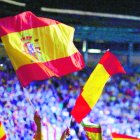 A girl waves a Spanish flag during a rally of the fledging far-right party VOX in Madrid, Spain, Sunday, Oct. 7, 2018. Thousands of Spaniards have attended a rally of the fledging far-right party VOX as it tries to grab a foothold in Spain's political spectrum. (AP Photo/Manu Fernandez)