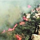 In this photo issued by Cabildo de Gran Canaria, flames from a forest fire burn close to houses in El Rincon, Tejeda on the Spanish Gran Canaria island on Sunday Aug. 18, 2019. Authorities on Spain's Canary Islands say around 5,000 people have been evacuated due to a wildfire that has ravaged more than 1,700 hectares (4,200 acres) since it broke out Saturday.(Cabildo de Gran Canaria Via AP)