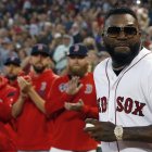 Former Boston Red Sox's David Ortiz comes onto the field to throw out a ceremonial first pitch before a baseball game against the New York Yankees in Boston, Monday, Sept. 9, 2019. (AP Photo/Michael Dwyer)