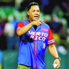 MLB Hall of Fame player Roberto Alomar of Puerto Rico greets the member of Panama's team prior the Caribbean Series baseball game between Puerto Rico and Panama in San Juan, Puerto Rico, Saturday, Feb. 1, 2020. (AP Photo/Fernando Llano)