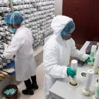 Wuhan (China), 02/03/2020.- Staff members operate an intelligent dispensing machine for the production of traditional Chinese medicine (TCM) for coronavirus and COVID-19 patients in Tongji Hospital in Wuhan, China, 02 March 2020. The hospital has been using a mixture of TCM and western drugs to treat people infected with the coronavirus. Although there is no specific treatment for the COVID-19 disease, more than 80 percent of China's coronavirus patients were prescribed the use of TCM alongside Western drugs with experts citing a higher recovery rate compared to just the use of mainstream treatments, according to local reports. EFE/EPA/YFC CHINA OUT