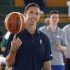 Former Los Angeles Lakers' player Steve Nash spins the ball at the start of a four-day training camp held at a university in Havana, Cuba, Thursday, April 23, 2015. Former NBA greats Steve Nash and Dikembe Mutombo have opened their training camp for Cuban basketball players, hoping to boost the game's popularity on the communist-run island following the declaration of detente between Washington and Havana. (AP Photo/Desmond Boylan)