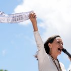 FILE - Opposition leader Maria Corina Machado holds up tally sheets during a protest against the reelection of President Nicolás Maduro one month after the disputed presidential vote which she says the opposition won by a landslide, in Caracas, Venezuela, Aug. 28, 2024. (AP Photo/Ariana Cubillos, File)