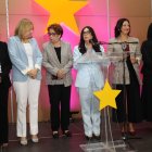 Kenia Lora, al centro y dirigentes PLD.  Guillermo Burgos