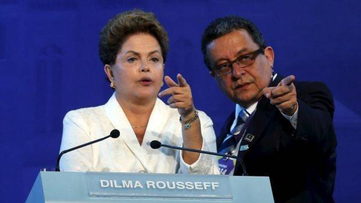 Brazil's President and Workers' Party (PT) presidential candidate Dilma Rousseff (L) talks with Joao Santana, head of the electoral accompaniment, before a television debate in the city of Aparecida do Norte, Brazil, in this September 16, 2014 file photo. Brazilian police said on February 22, 2016 that they obtained an arrest warrant for Santana, the architect of Rousseff's electoral campaigns, complicating her fight to survive an investigation of her re-election in 2014 and stave off impeachment by Congress. The investigation of campaigner Joao Santana, known as 