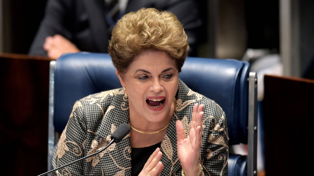 TOPSHOT - Suspended Brazilian President Dilma Rousseff answers to questions during the impeachment trial, at the National Congress in Brasilia, on August 29, 2016. Rousseff who testified for the first time at her trial, urged the Senate to vote against impeaching her, denying charges that she fiddled government accounts. / AFP / EVARISTO SA