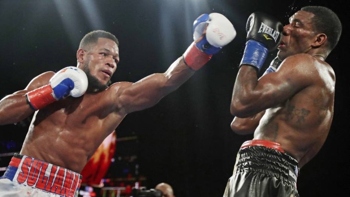 Cuba's Sullivan Barrera punches Dominican Republic's Felix Valera during the 10th round of a light heavyweight boxing match Saturday, Nov. 25, 2017, in New York. Barrera won the fight. (AP Photo/Frank Franklin II)
