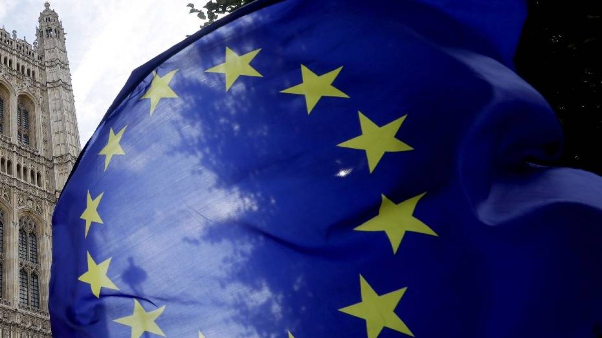 A European Union flag flies near Britain's Parliament in London, Thursday, Sept. 26, 2019. An unrepentant Prime Minister Boris Johnson brushed off cries of 