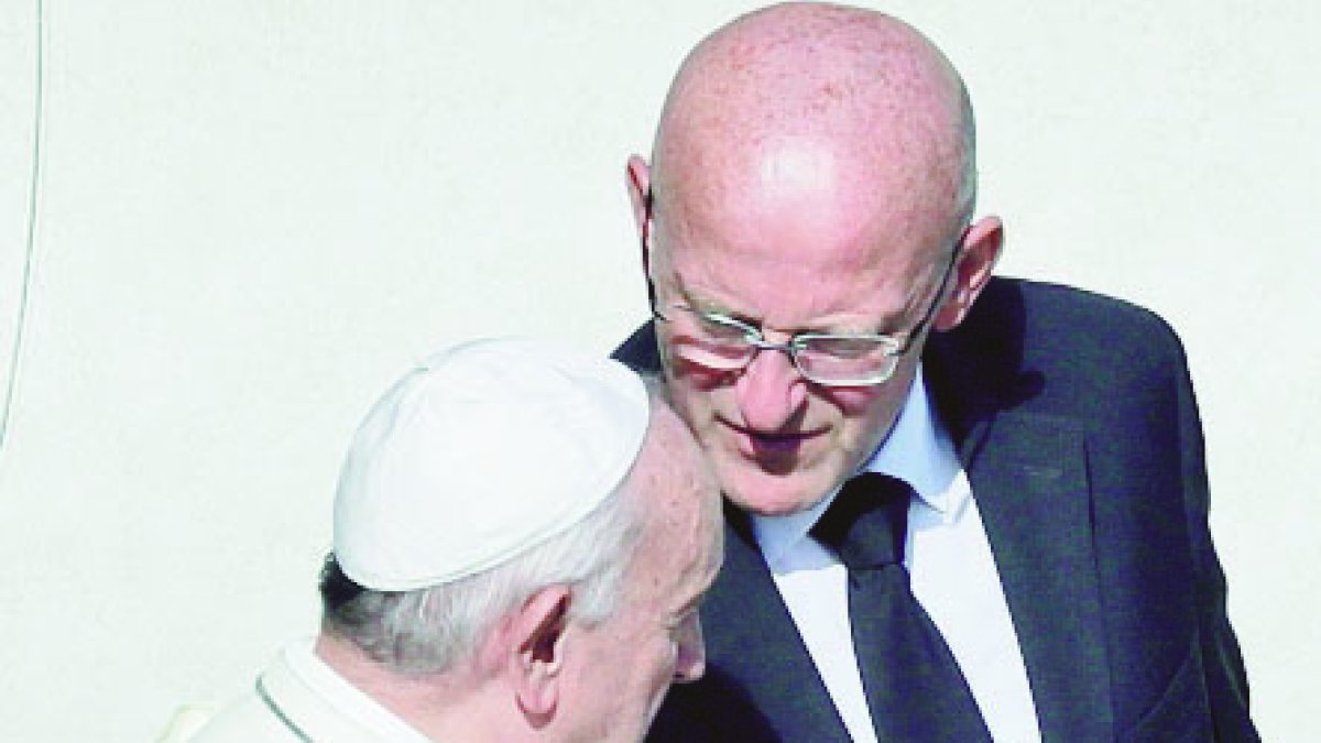 Vatican head of security Domenico Giani, right, shares a word with Pope Francis at the end of a canonization Mass in St. Peter's Square at the Vatican, Sunday, Oct. 13, 2019. The Vatican said Monday Oct. 14, 2019 that Francis’ chief bodyguard Giano has resigned over the leak of a Vatican police flyer identifying five Holy See employees who were suspended as part of a financial investigation, adding that Giano bore no responsibility for the leak, but that he had resigned to ensure the serenity of the investigation and “out of love for the church and faithfulness” to the pope. (AP Photo/Alessandra Tarantino)