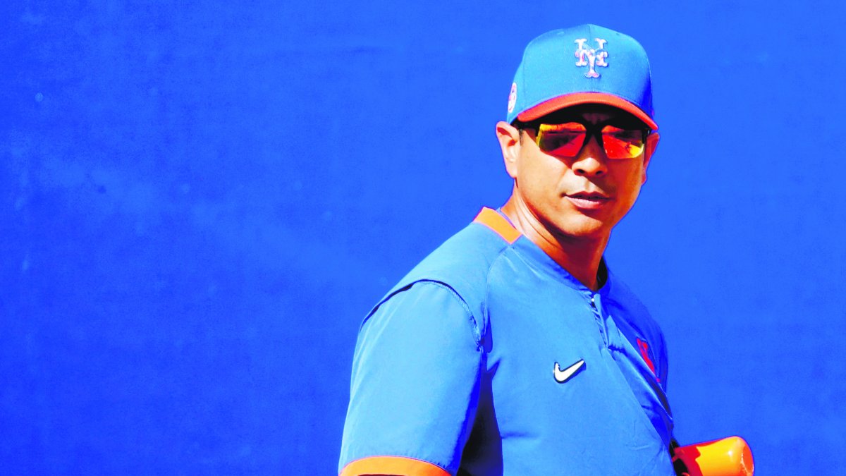 New York Mets manager Luis Rojas watches his team during spring training baseball practice Saturday, Feb. 15, 2020, in Port St. Lucie, Fla. (AP Photo/Jeff Roberson)