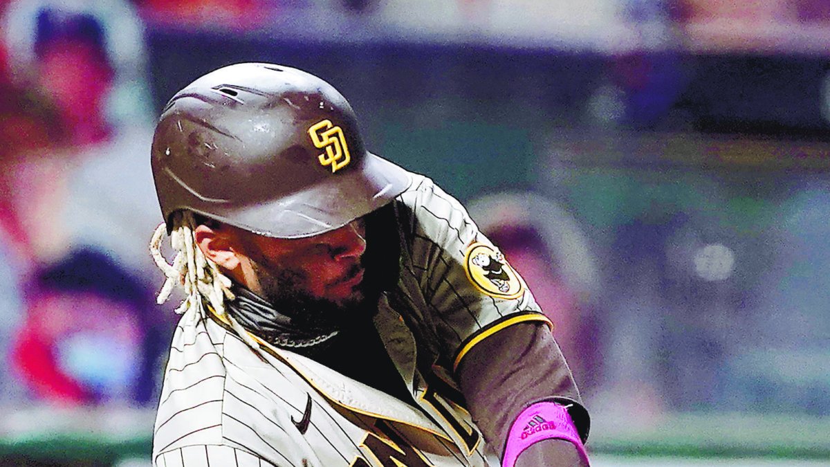 San Diego Padres' Fernando Tatis Jr. hits a two-run home run against the San Francisco Giants during the first inning of the second game of a baseball doubleheader Friday, Sept. 25, 2020, in San Francisco. (AP Photo/Tony Avelar)