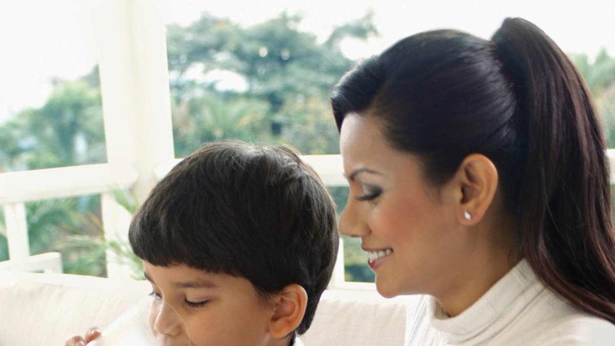 Mother with child, drinking milk