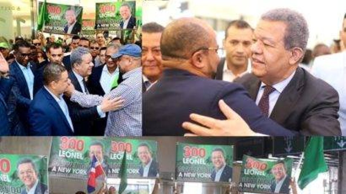 Personas saludando a Leonel Fernández