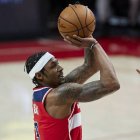 Washington Wizards guard Bradley Beal shoots a three-point basket against the Portland Trail Blazers during the first half of an NBA basketball game in Portland, Ore., Saturday, Feb. 20, 2021. (AP Photo/Craig Mitchelldyer)
