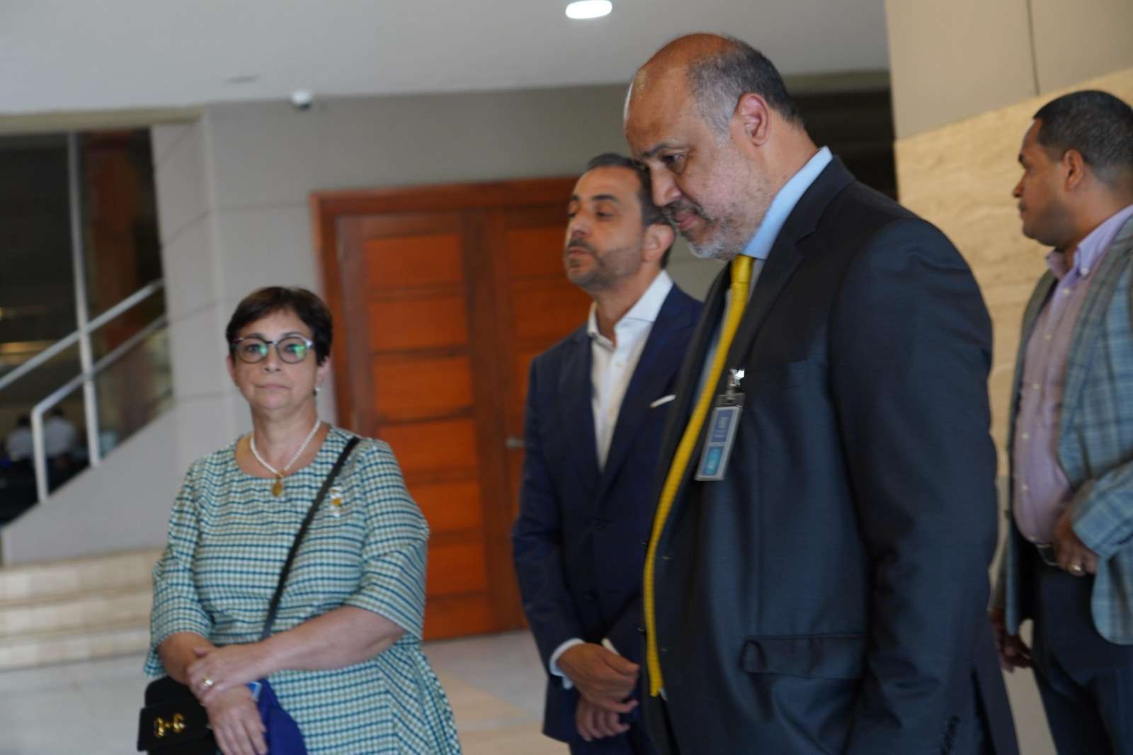 Maribel y Antonio Espaillat, junto a Miguel Valerio, su abogado.